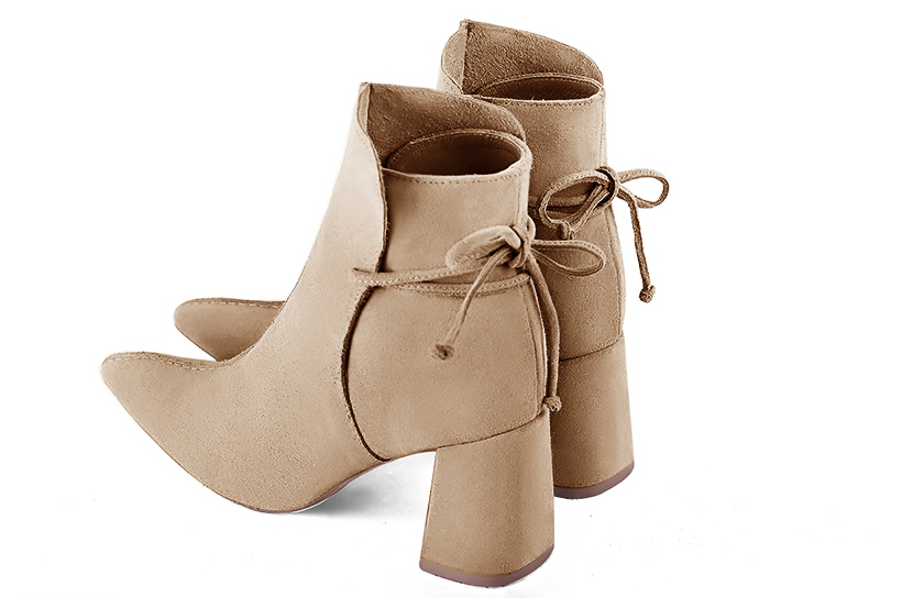 Tan beige women's ankle boots with laces at the back. Tapered toe. High flare heels. Rear view - Florence KOOIJMAN